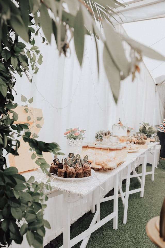 tables decoration under white frame tent
